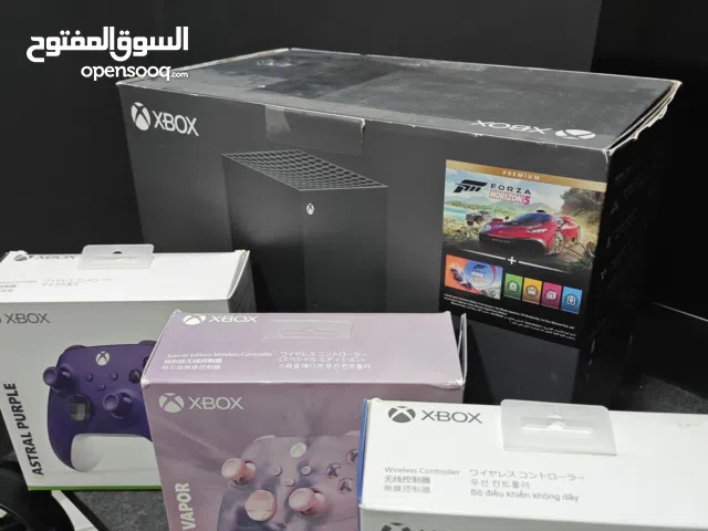 Xbox series x and three controllers