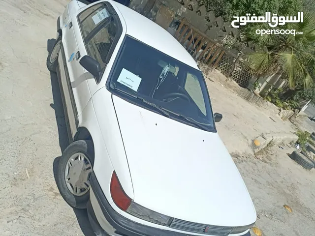 ميتسوبيشي لانسر موديل 1990 اوتوماتيك الاصلي انجكشن خالي قص وقلبان بحاله جيده جدا