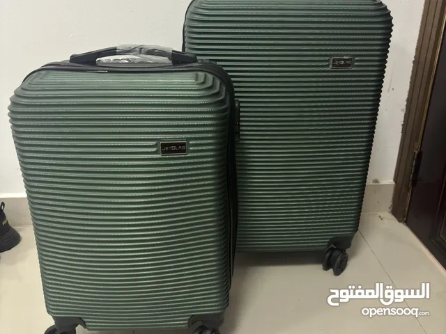 Different sizes green travel bag