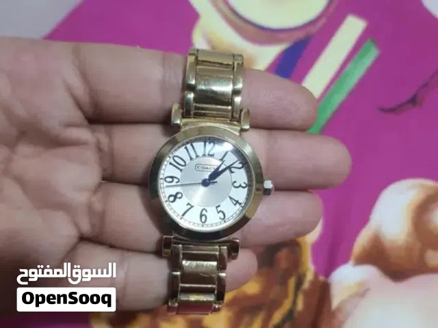 للبيع ساعة Coach أصلية لون دهبي - مينا أبيض - زي الجديدة
