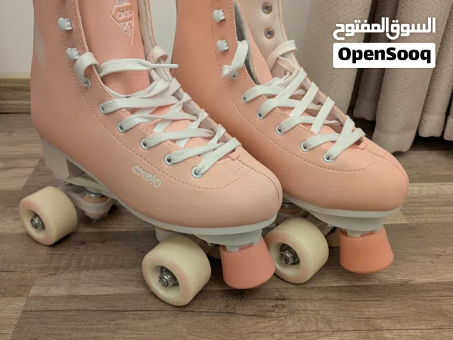 بتيناج Oxelo 100 Series - حذاء تزلج مع معدات الحماية من ماركة Oxelo