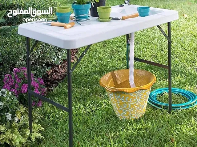 طاولة و مغسلة صحون مصنوعة من مادة فايبر