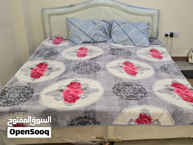 1.double bed with blanket pillows and bed sheet 2.refrigirator 3.washingmachine 4.cupboard