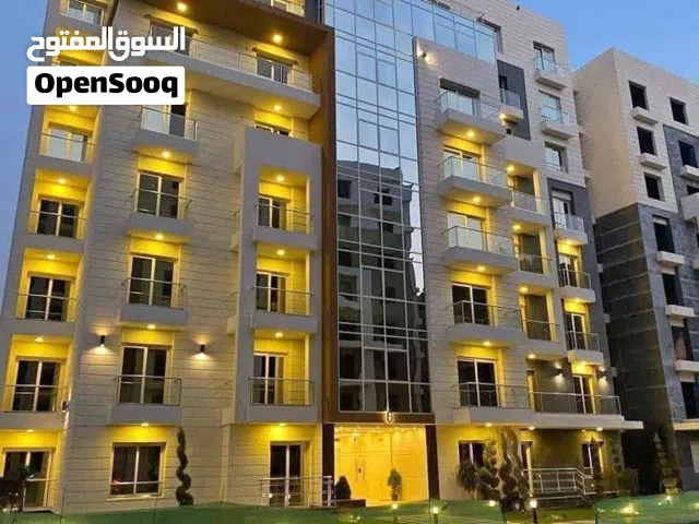 شقة استلام فوري بخصم ع الكاش 50% بحديقة داخل كمبوند OIA في العاصمة الإدارية الجديدة المساحة: 130