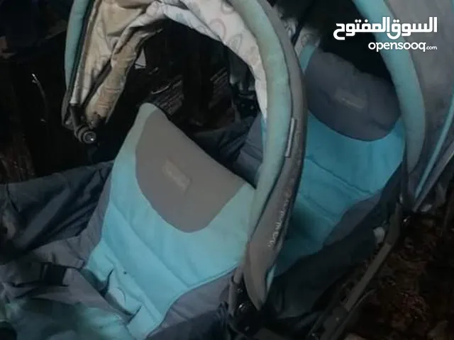 عربة اطفال توأم