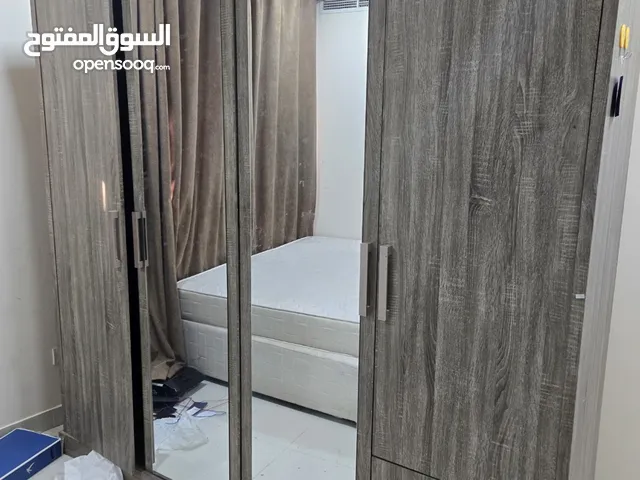 wardrobe and dressing table and small table