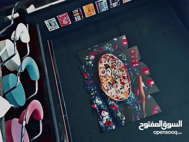 مطعم سناكات وبيتزا للضمان في شارع الجاردنز