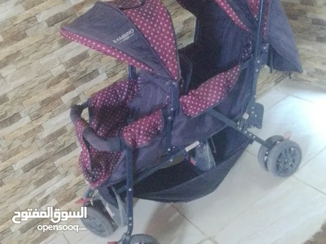 عربايه اطفال مقعدين مستعمله بي حاله جيده سعر23