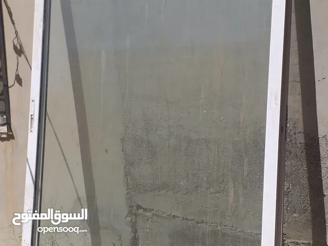 باب واجه باب محل المنيوم سحاب لون حليبي مقاس 2،80م ×2،30م