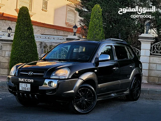 هونداي توسان 2005 لون أسود مُلوكي فل كامل أعلى صَنف ( MX ) مآلك ثاني من الشركة بحالة ممتازه للبيع