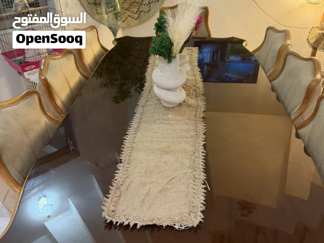 ميز طعام خشب وزجاج