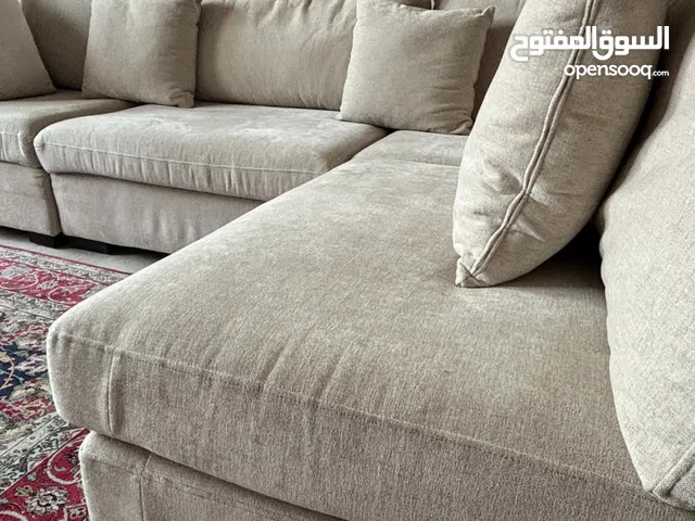 Sofa corner with 4 cushions excellent condition beige color used for 4 months only