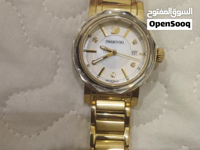 gold-tone Swarovski Octea Mini watch, reference number 999971, with a mother-of-pearl dial