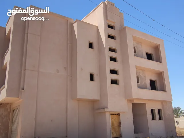 مبنى نص تشطيب للإستثمار او الإجار وكل شي موضح في الصور المكان تاجوراء خلف مركز البحوث الصناعية