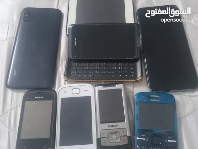 مجموعة نوادر قطع عملات قديمة تلفونات قديمة فضة اراقيل الكترونية وغيرها
