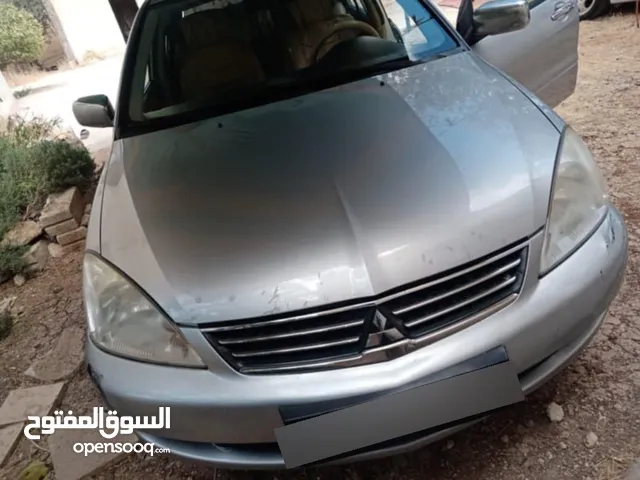 ميتسوبيشي لانسر كويتيه 2013 فل كامل وفحص كامل حبه مميزه بالاردن
