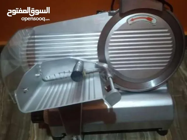 ماكينه تقطيع لانشون و بسطرمة شبه جديده