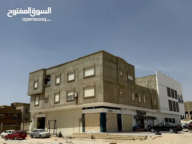 مبنى تجاري و سكني في طريق النهر بجوار العائلة مول