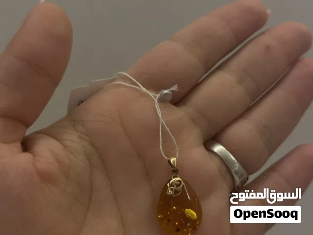 Silver pendant with natural amber