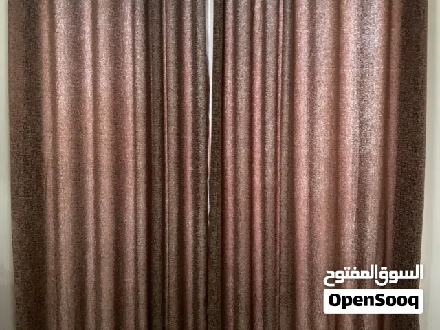 Brown curtains (255cm x245cm) with bronze curtain rods 2 sets 200x2 =AED400