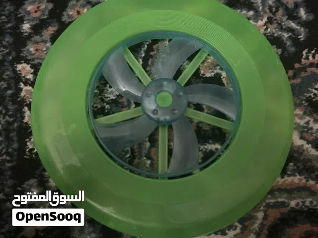 طبق طار اخضر اللون و الجزء الأزرق يضى بنور بيعة سريعة و توصيل في نفس اليوم