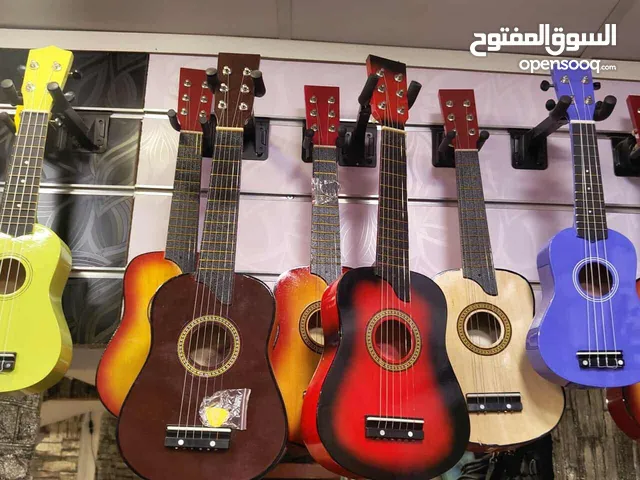 جيتار بيبي جديد الطول 65سم مسكر بالكرتونه مع ريشه ووتر ( صغير )