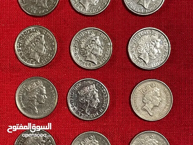عملات معدنية بريطانية والمانية وهولاندية. انظر الصور.