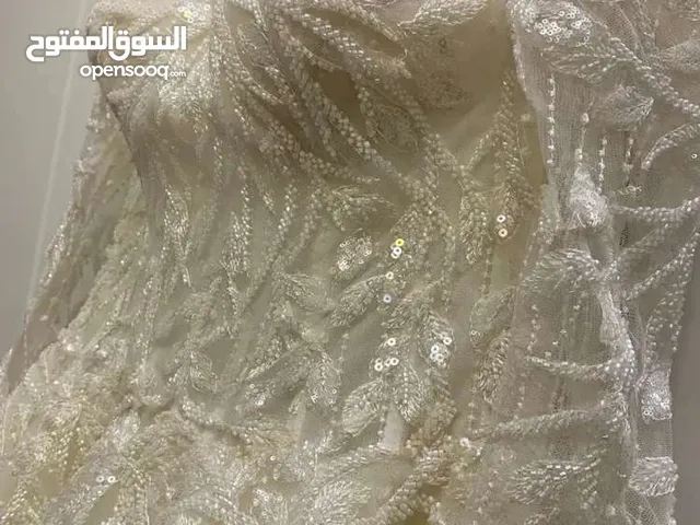 فستان زواج مستخدم من المصممه منال العمير
