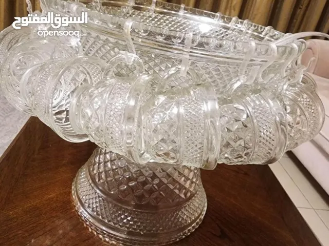 Glass bowl with cups and spoon