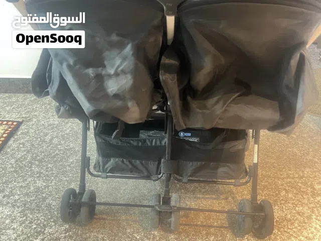 عربة اطفال تؤام ثنائية