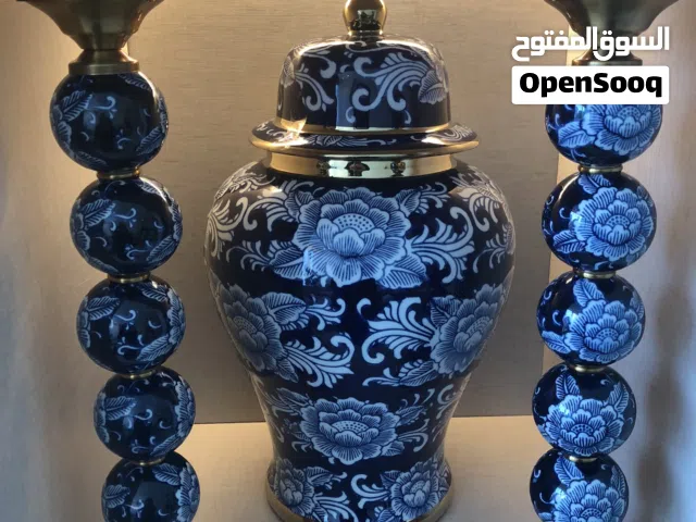 طقم عبارة عن جرة سيراميك و عدد 2 شمع دان سيراميك في نحاس