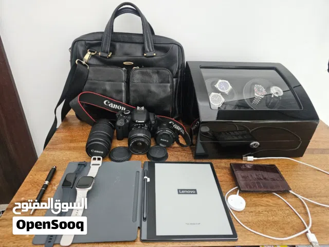 Office Accessories for the Daring Executive, Smart Watch, Notebook, DSLR Camera with,  Lenses