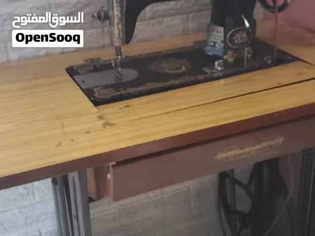 مكينه خياطه من ماركه الأسد نضيف  مع الطاوله السعر 35الف