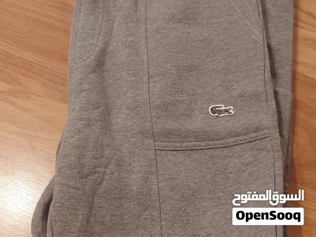 بنطلون رياضة جديد صناعة المانيا لون اسود قياس لارج بنطلون لاكوست صناعة كمبوديا لون سكني قياس لارج