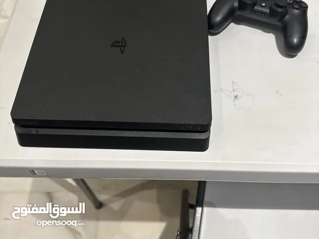 Used PlayStation 4 with all the wires and a controller