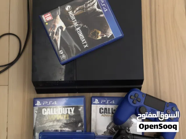 PlayStation 4 with 2 controllers and games