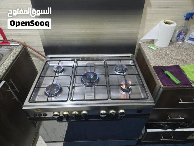 بوتجاز مع اسطوانة غاز وكاتيل للماء