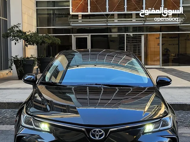 تويوتا كورولا هايبرد فحص كامل وارد المركزية وصيانة المركزية لون اسود مميز بحالة جيدة جدا كوشوك جديد