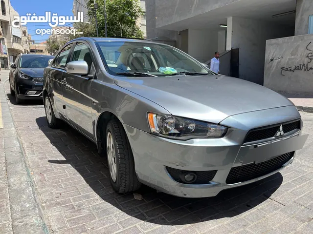 سيارة متسوبيشي لانسر EX موديل 2015 بحالة ممتازة، سبب البيع: السفر خارج الاردن