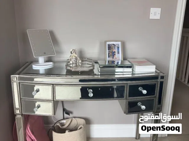 This is a modern silver mirrored dressing table with crystal-style knobs comes with a big mirorr