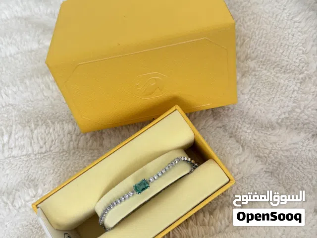اسواره سوارفسكي اصليه لون فضي مع جوهره الكريستال باللون الاخضر