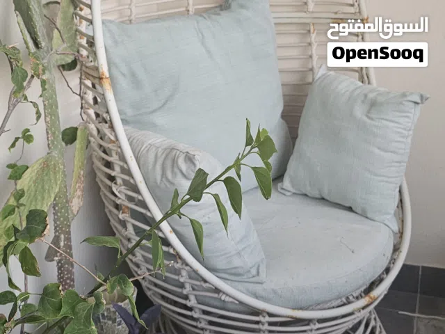 Outdoor chair with cushions. sightly damaged on seat as shown.