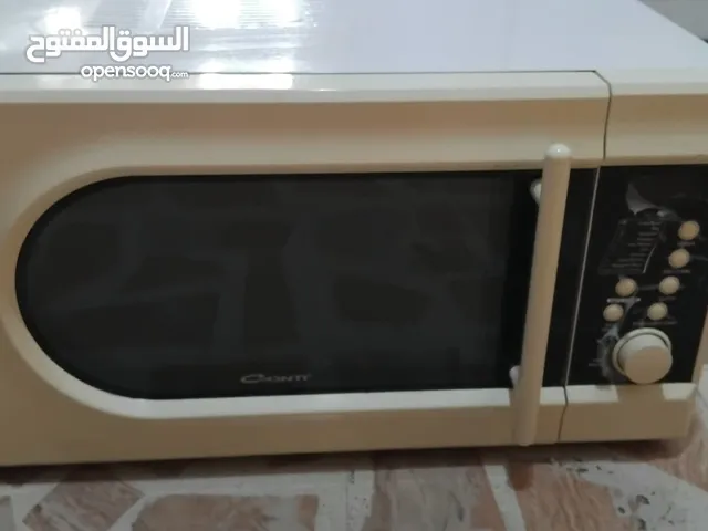 ميكرويف نوع  كونتي لون ابيض  38 لتر مع شواية يعمل بشكل ممتاز جدا  ونظيف من الداخل والخارج