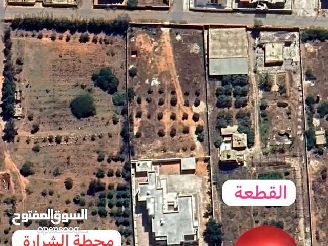 نصف هكتار الموقع طريق طرابلس بجانب محطة وقود الشرارة على الطريق مباشر