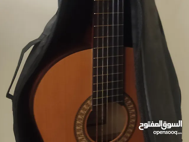 Classical guitar with all the necessary accessoriesجيتار كلاسيكي مع جميع الملحقات اللازمة