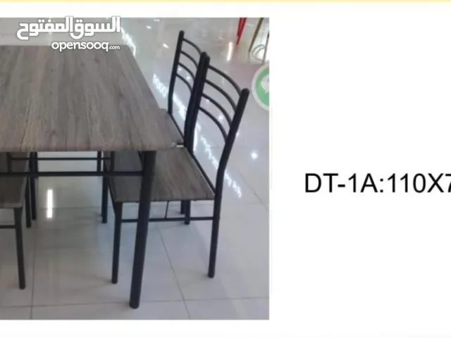 Modern Simple Dining Table and Chairs Set Hot Sale Metal Tube and MDF Board for Living Room.