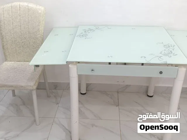 Embossed design glass dining set and Teapoy