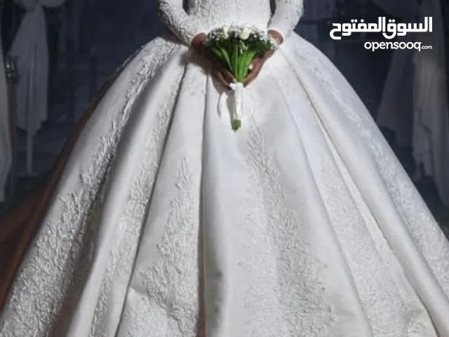 فستان فرح ابيضّ للعروسة أتلبس مرة واحدة
