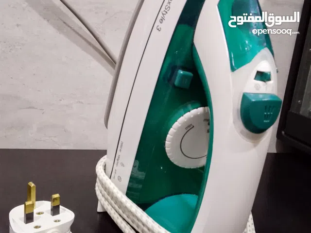 مكواة مستعمل مع طاولة