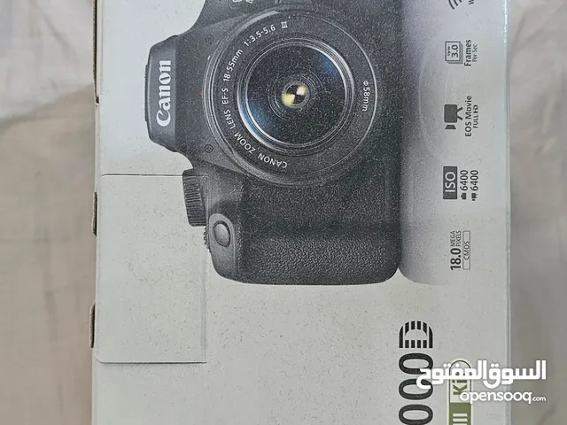 Canon EOS 4000D camera with lens.
